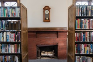 Fireplace flanked by books