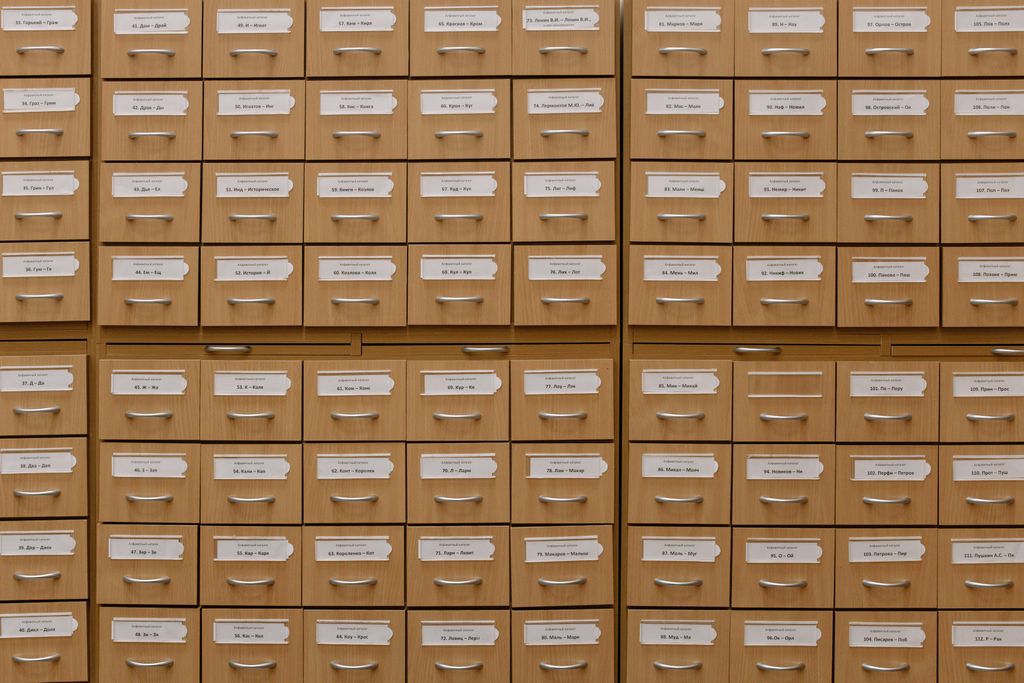 Close-up of labeled wooden storage drawers, perfect for organization concepts.